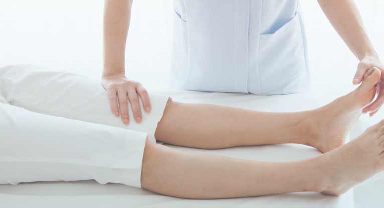 doctor checking a leg