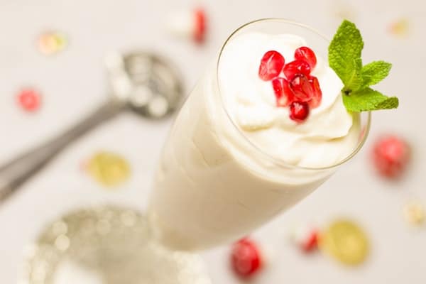 a glass of yogurt drink with strawberry